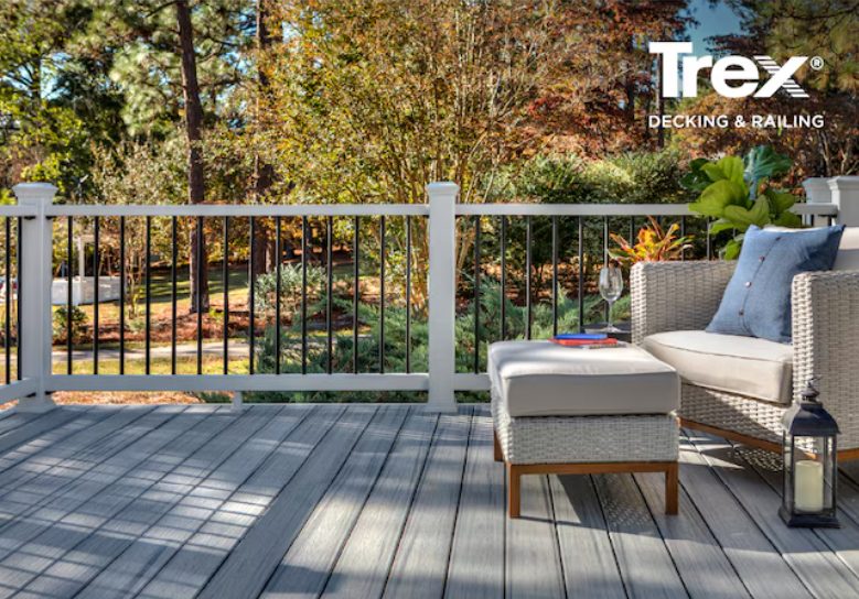 Composite deck with wood-tone boards and black balusters